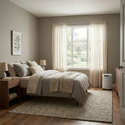 Airpura F700 air purifier in a bedroom