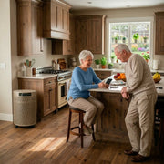 senior couple in open kitchen with Airpura p600 champagne mist air purifier