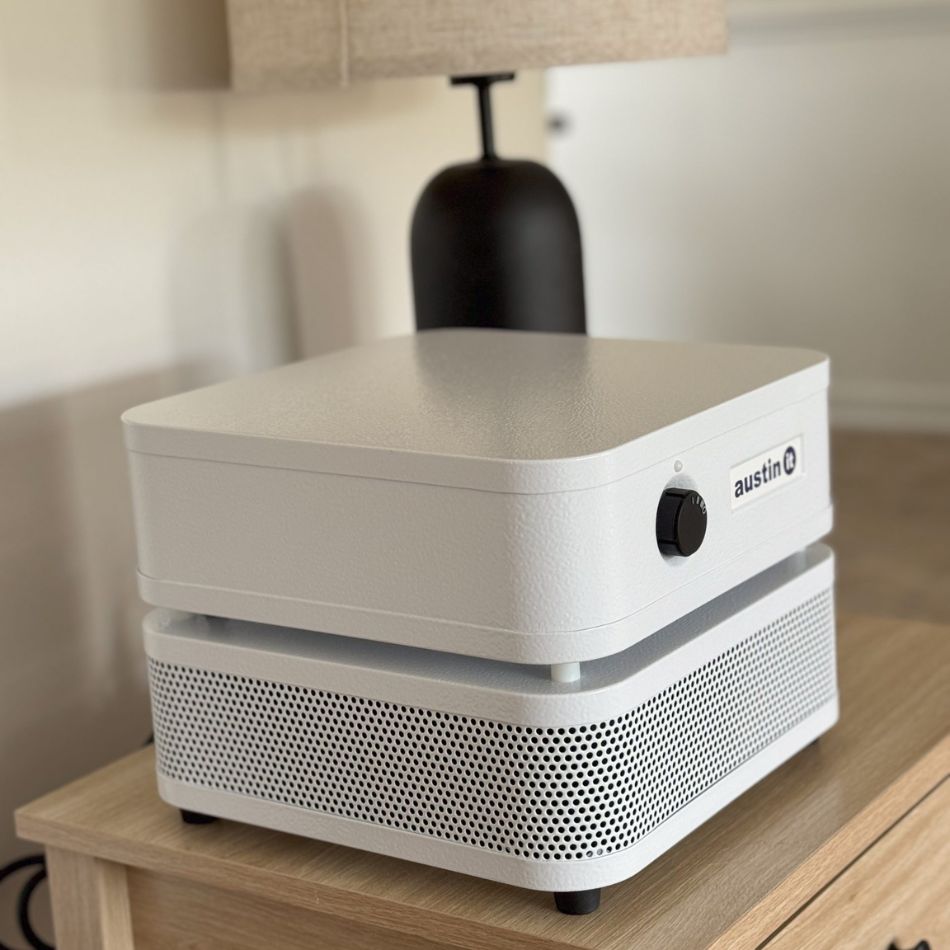 end table with Austin air "it" purifier and lamp