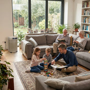 intergenerational family enjoying leisure activities in living room with airpura p700 air purifier